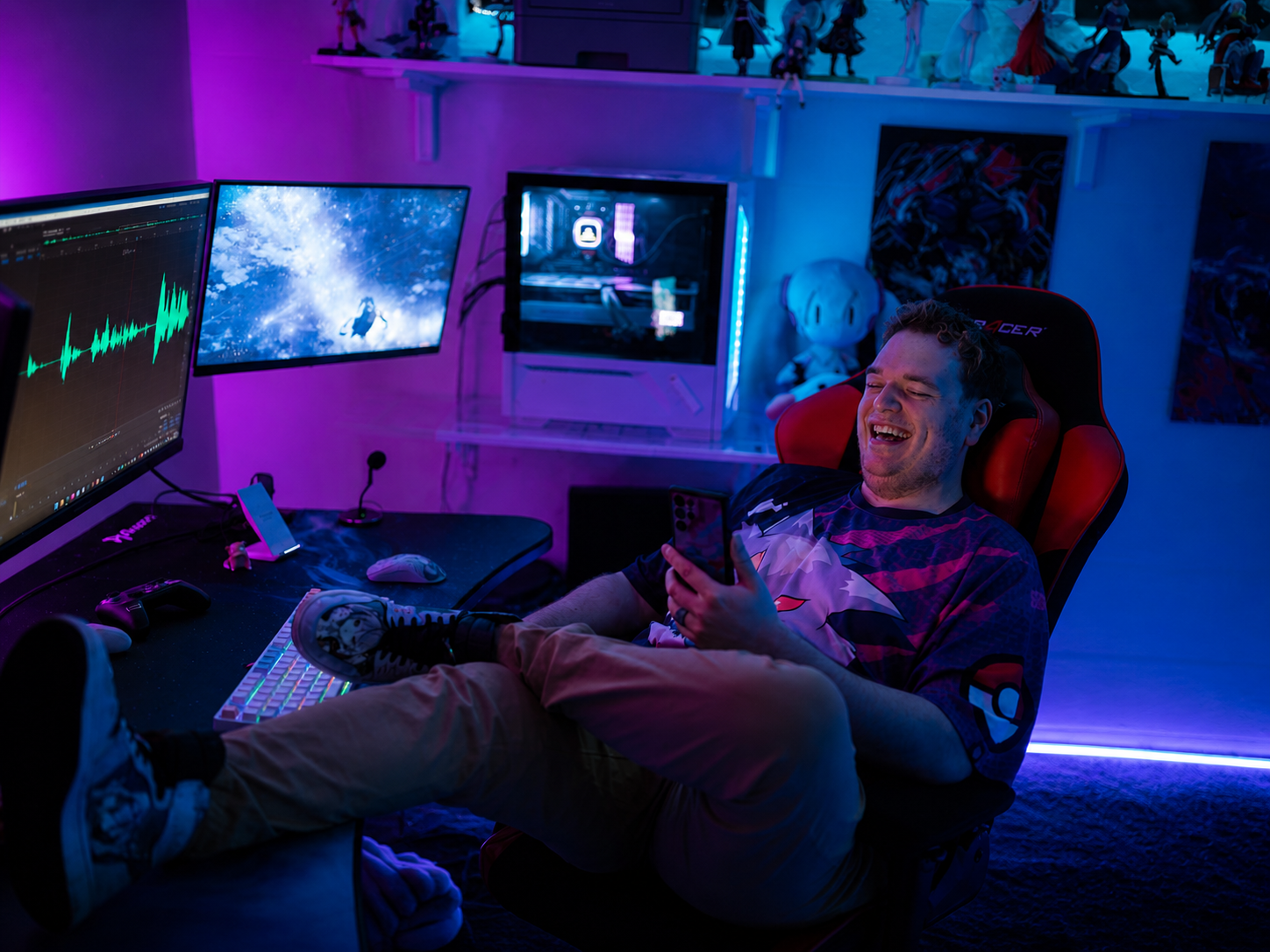 Zach laughing at his desk